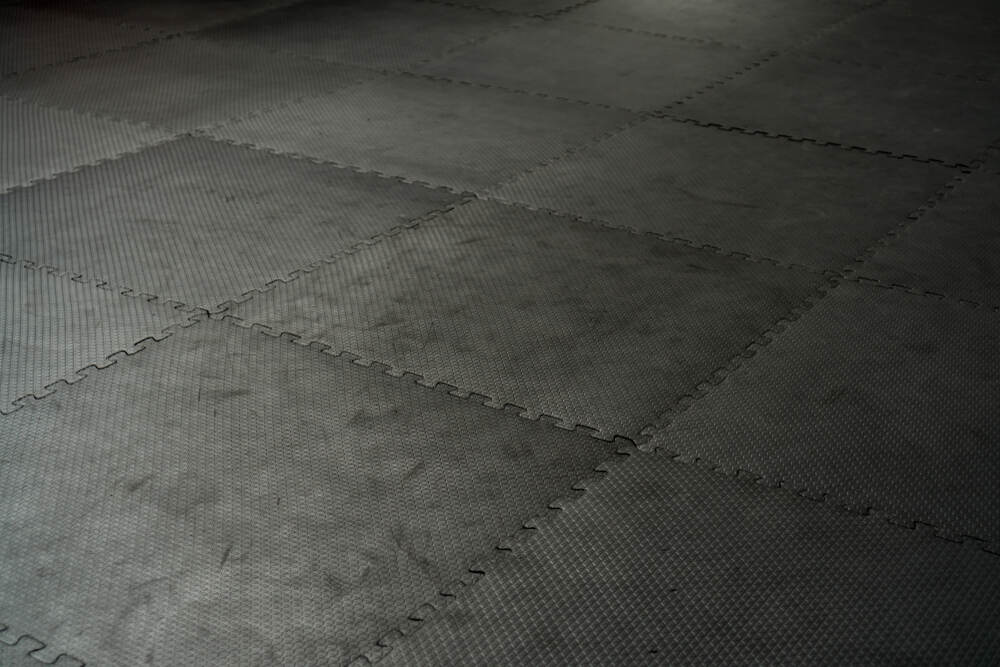 Black rubber floor tiles in a gym 
